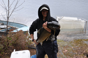 Cindy Chu holding a large lake trout from Lac Maganisipi