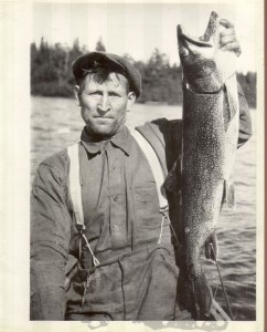 Ned Bowers - early 1930's Lake Opeongo holding up a large lake trout 